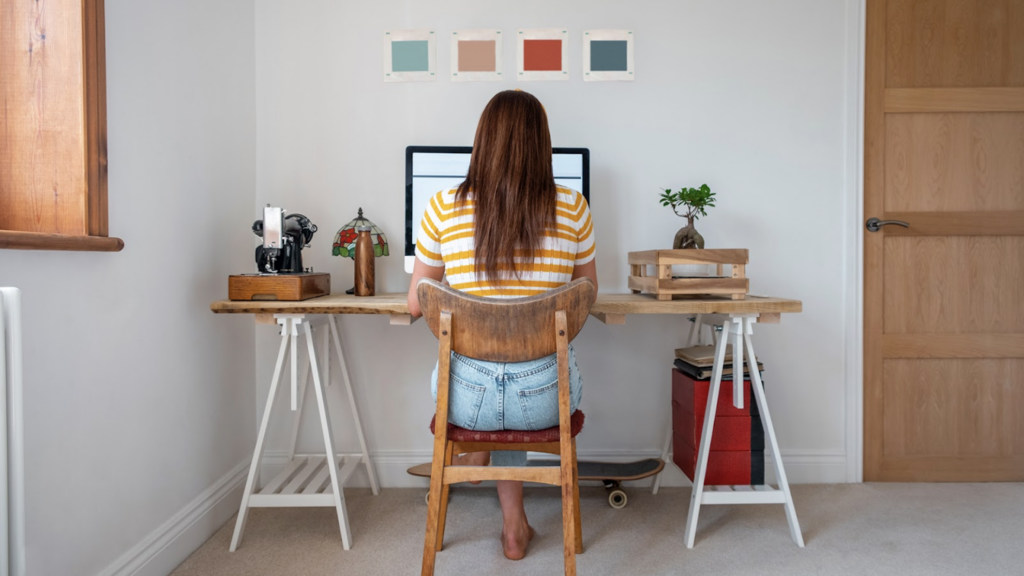 A women sitting at a home office desk